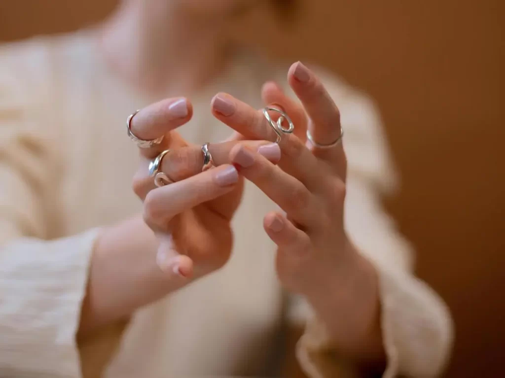 A women wearing silver jewellery. 